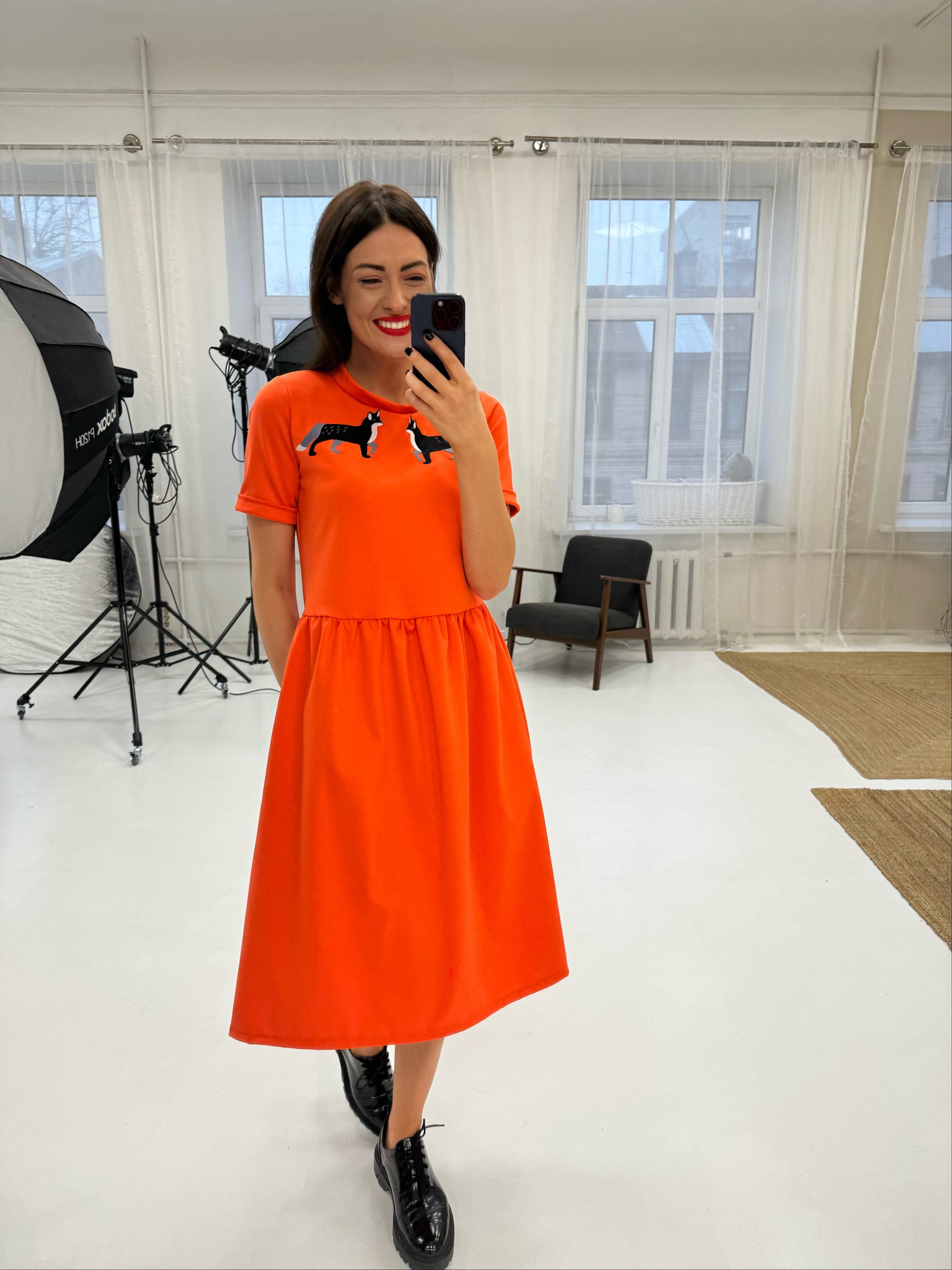 Orange dress with wolf embroidery